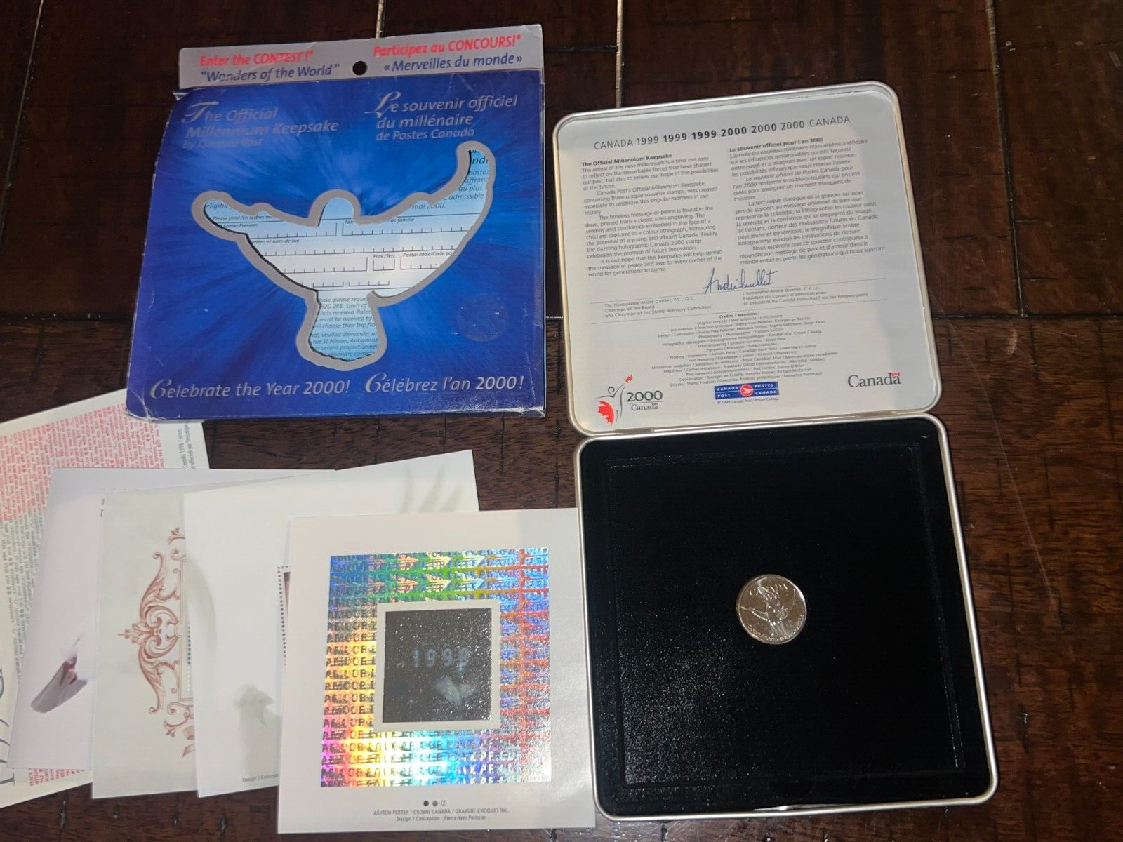 1999-2000 Millennium Keepsake Coin And Stamps (DENT IN BOX)