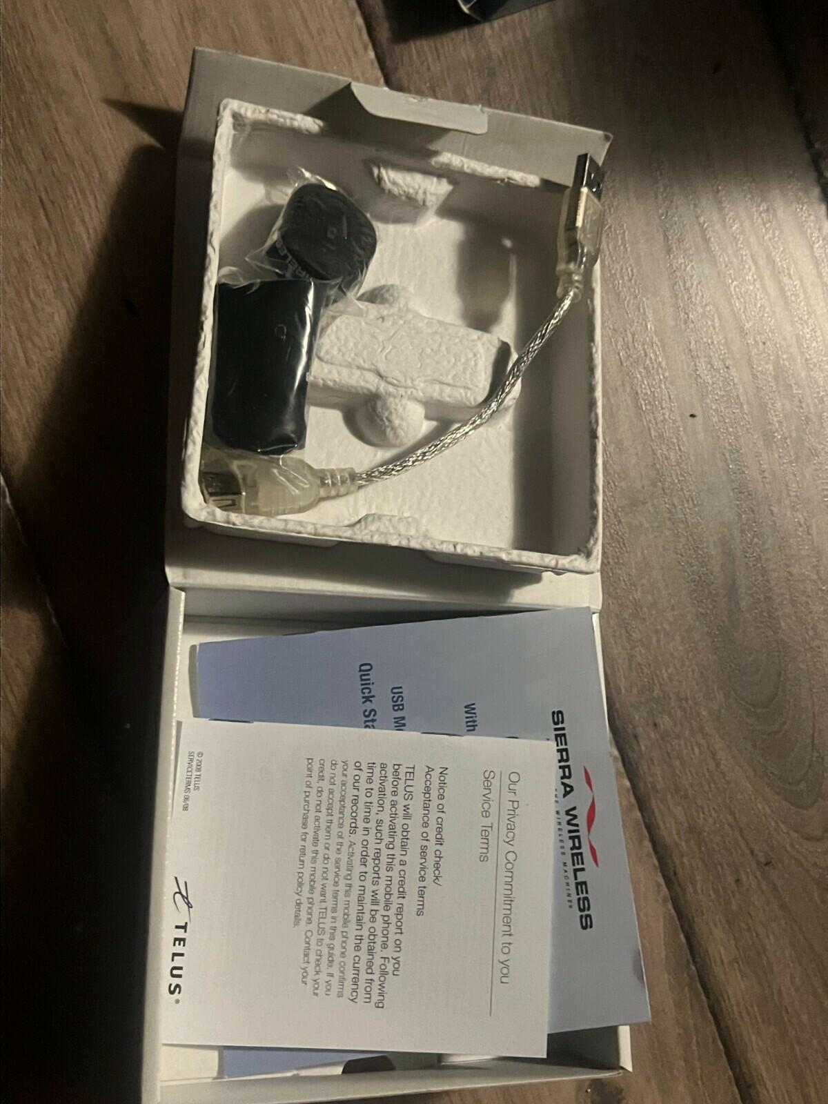 Sierra Wireless Compass 597 Telus USB Modem w/ 7" USB Cable, Pouch, And Box